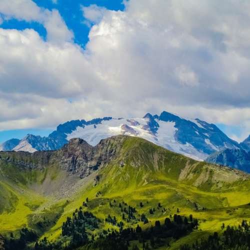 Breathtaking view of the beautiful grassy fields and mountains