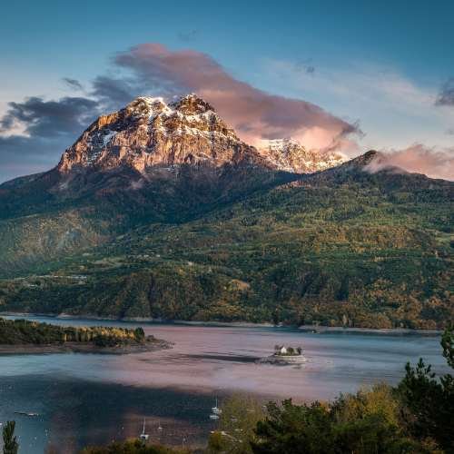 Idyllic shot of a huge mountain covered in vegetation with a body