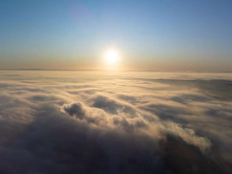Sunrise sunrise over a thick layer of fog in a small town in brazil drone photo