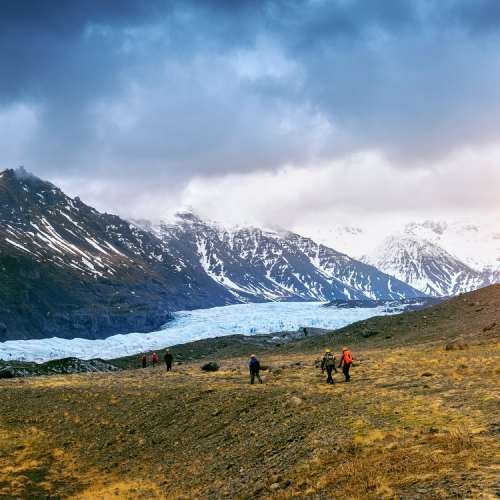 Tourist taking in skaftafell glacier, vatnajokull national park in iceland.